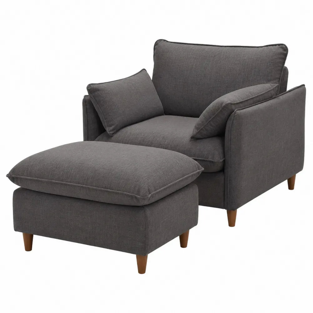 Poltrona con pouf poggiapiedi e cuscini in tessuto poliestere grigio scuro con gambe in legno marrone 75 x 80 x 90 cm
